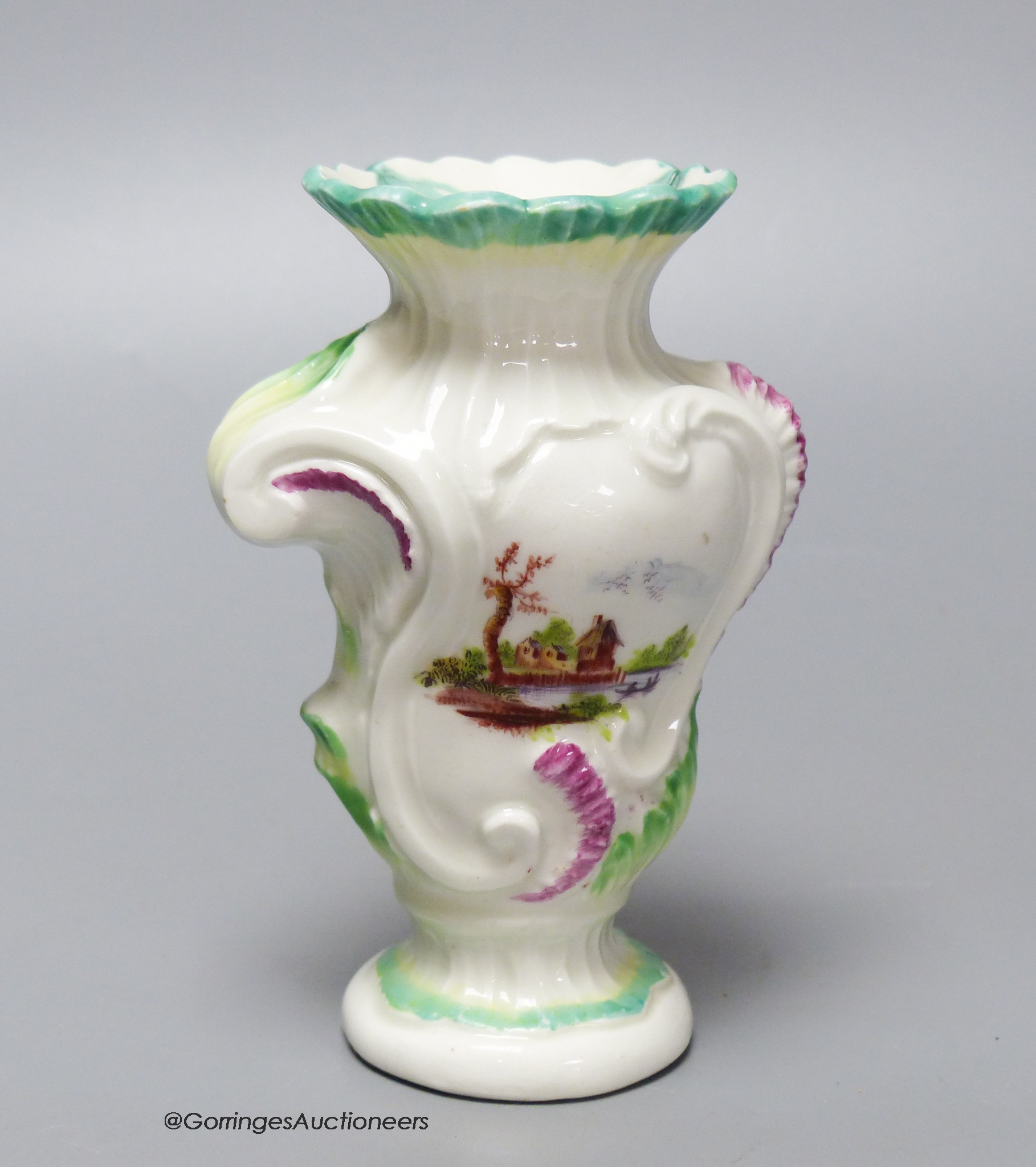 An 18th century Derby asymmetric vase painted with two landscapes, height 12.5cm